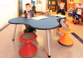 Innovative freeform team table. Sitting with momentum.